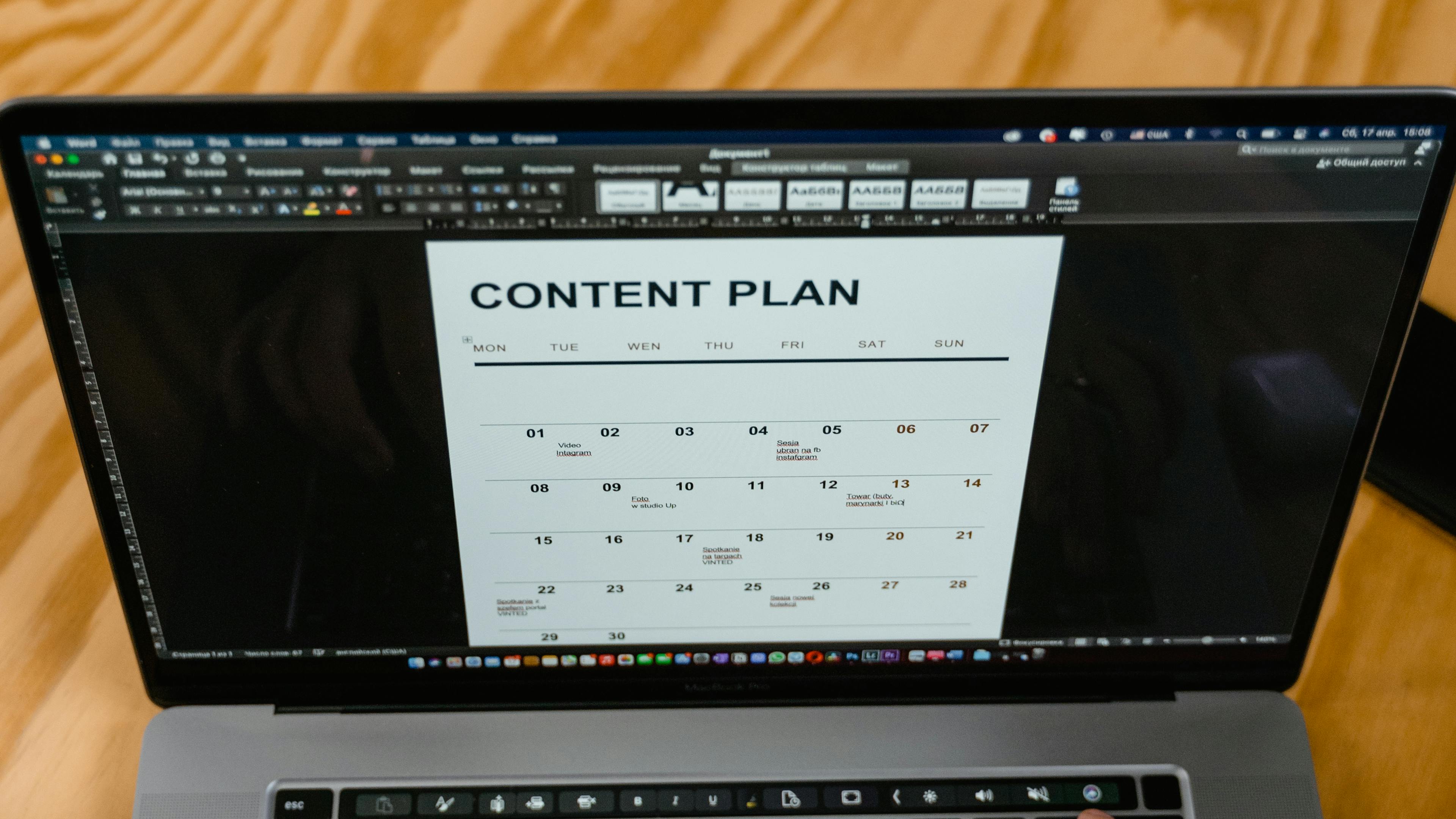 Content calendar planner on a monitor with scheduled social media posts, illustrating a content marketing system