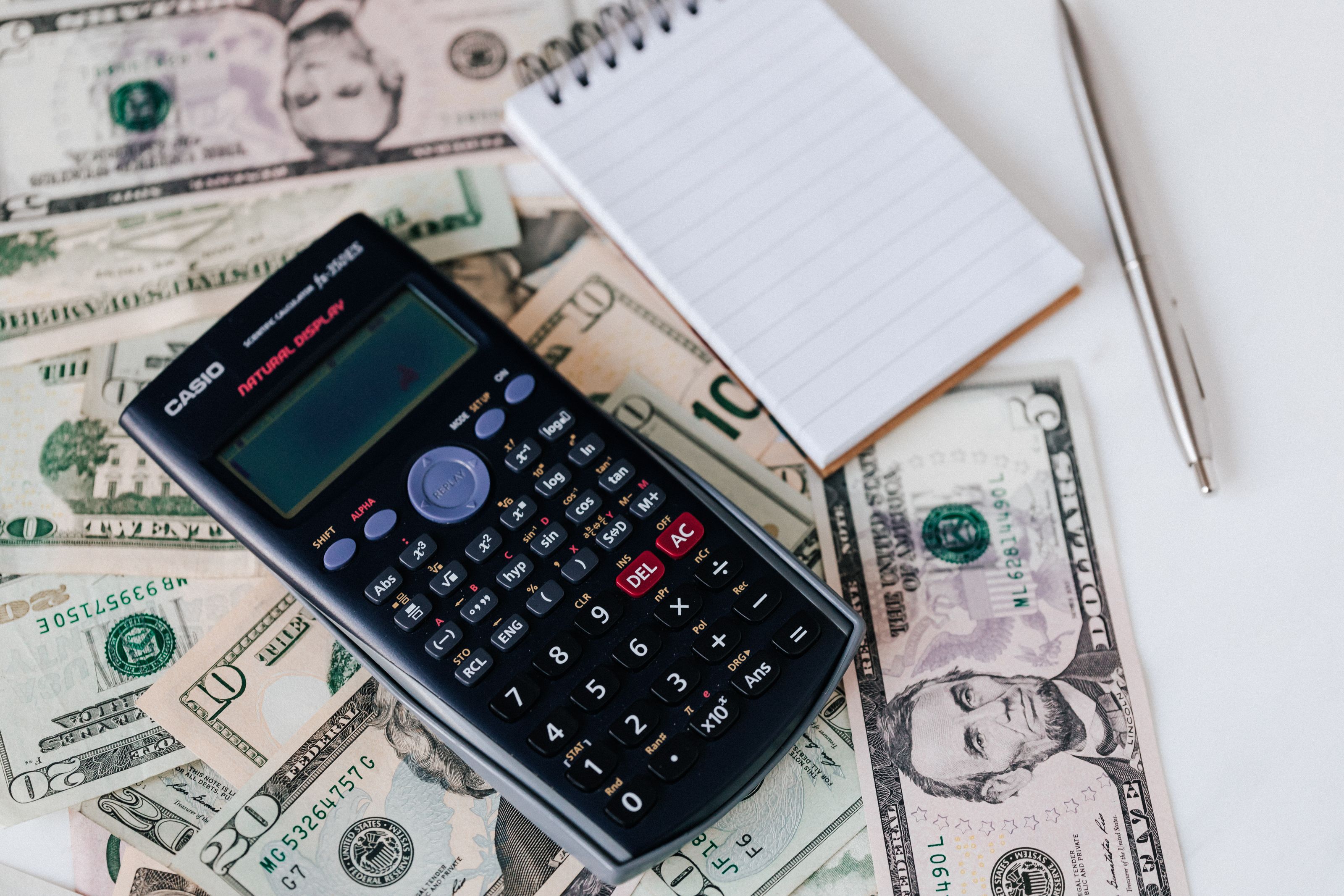 Accountant reconciling monthly revenue and expenses
